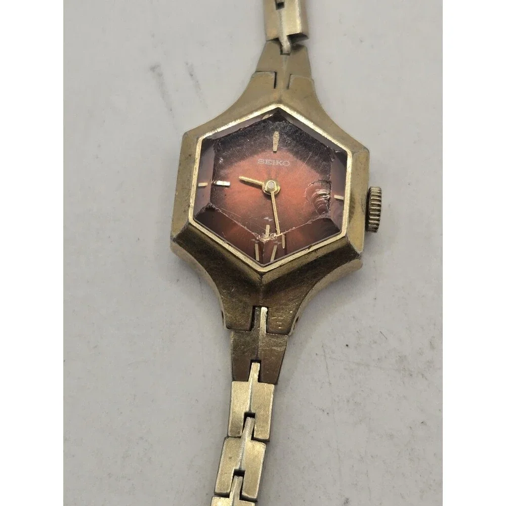 VTG Seiko Women’s Gold Tone Hexagon Red Burgundy Dial Manual Wind Watch 11-8029